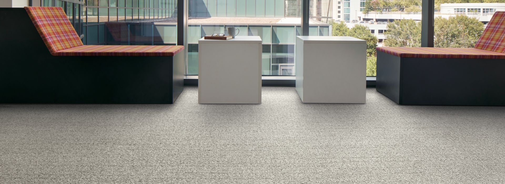 Interface Stitch in Time plank carpet tile with tables and chairs facing outside