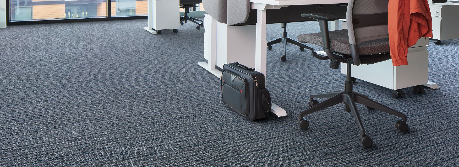 Interface WW865 carpet tile in office setting with desks and chairs
