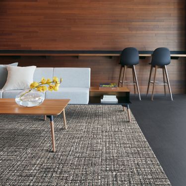 Interface WW895 and Shantung carpet tile in lobby area with table, sofa, and bar