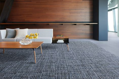 Interface WW895 and Shantung carpet tile in lobby area with table, sofa, and bar