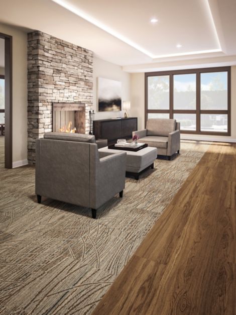 Interface Prairie Grass carpet tile inset into Natural Woodgrains LVT in senior housing lounge area imagen número 14