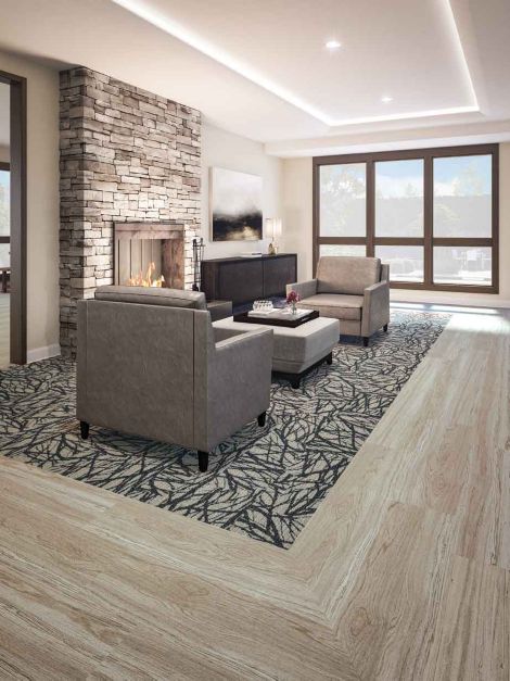 Interface GN161 plank carpet tile and Natural Woodgrains LVT in lounge area by fireplace image number 3
