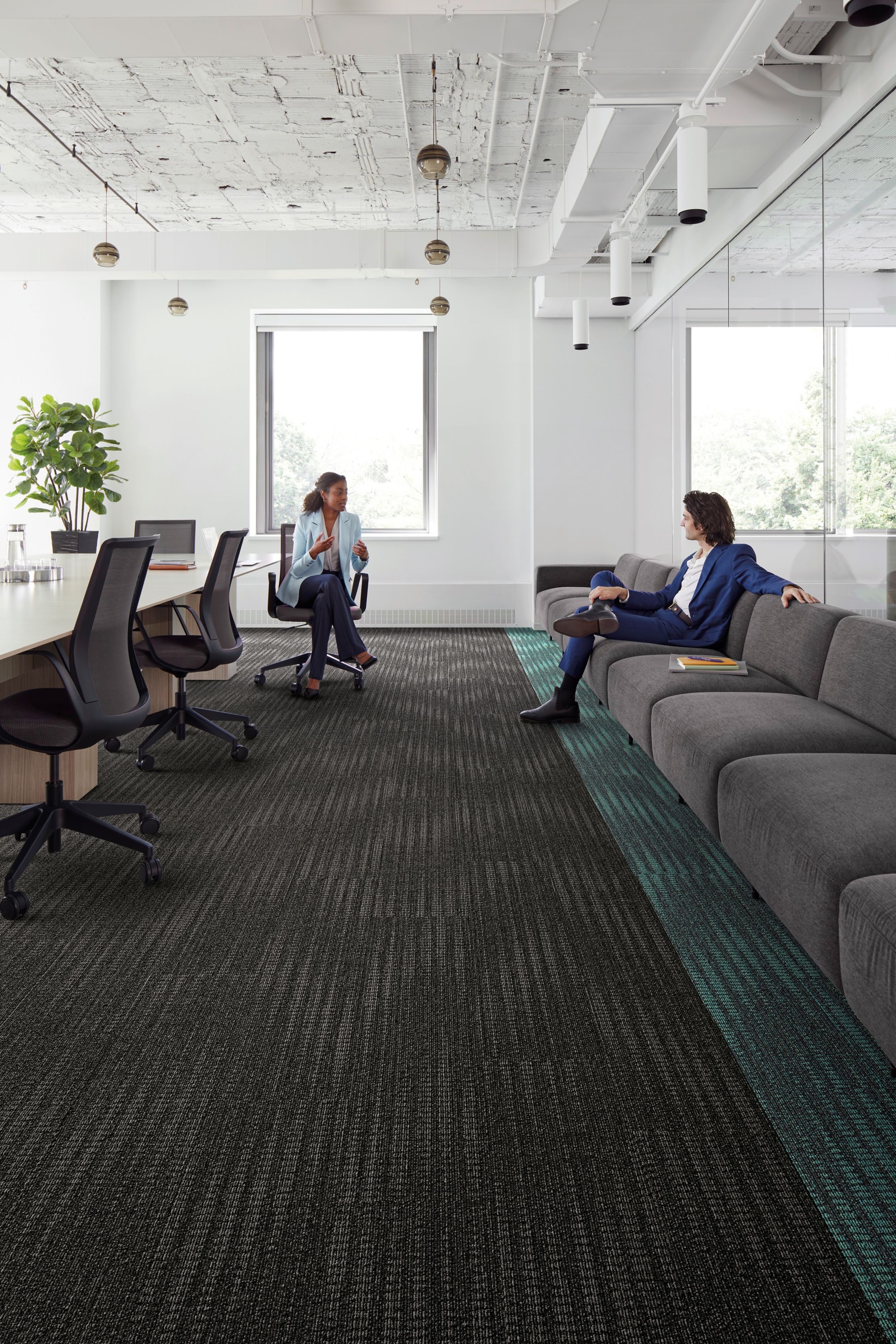 Interface Karmic Relief plank carpet tiles with man sitting on couch collaborating with woman in office chair image number 2