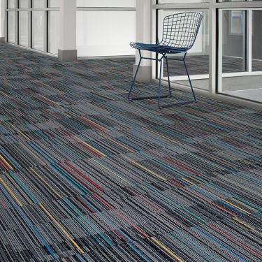 Interface Lima Colores carpet tile  in open corridor with single chair image number 1
