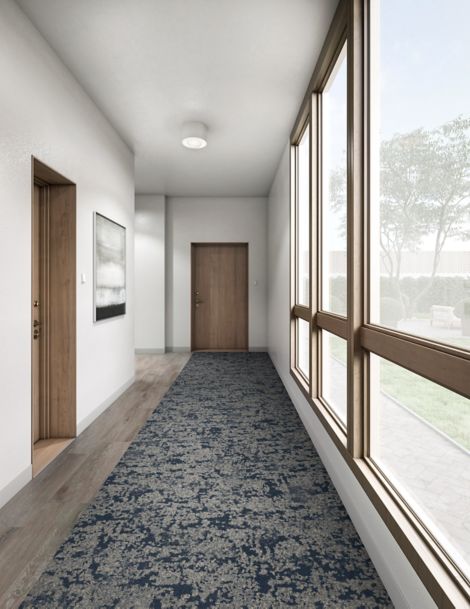 Interface Meadowland carpet tile in hallway with wooden door at end