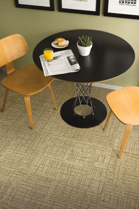 Interface Meet carpet tile in cafe area with black table and wooden chairs