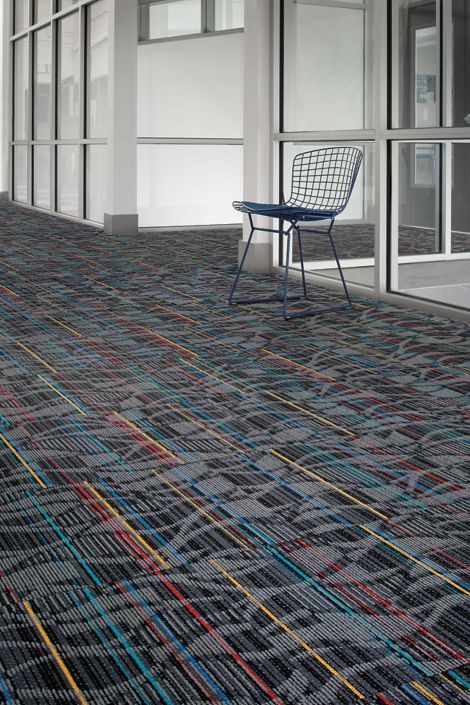 Interface Miramar Colores carpet tile in corridor with single blue chair image number 5