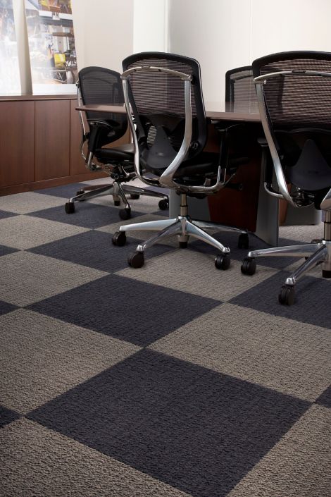 Detail of Interface Monochrome carpet tile in conference room