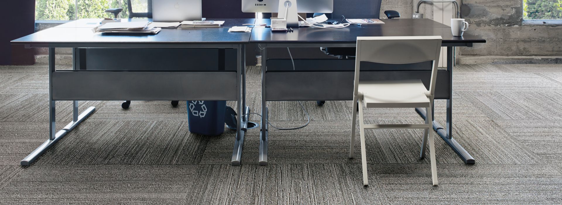 Interface NF400 plank carpet tile with a workstation