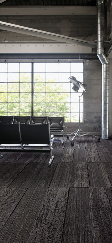 Interface NF400 and NF401 plank carpet tile in public space with black beam seating and large window image number 4