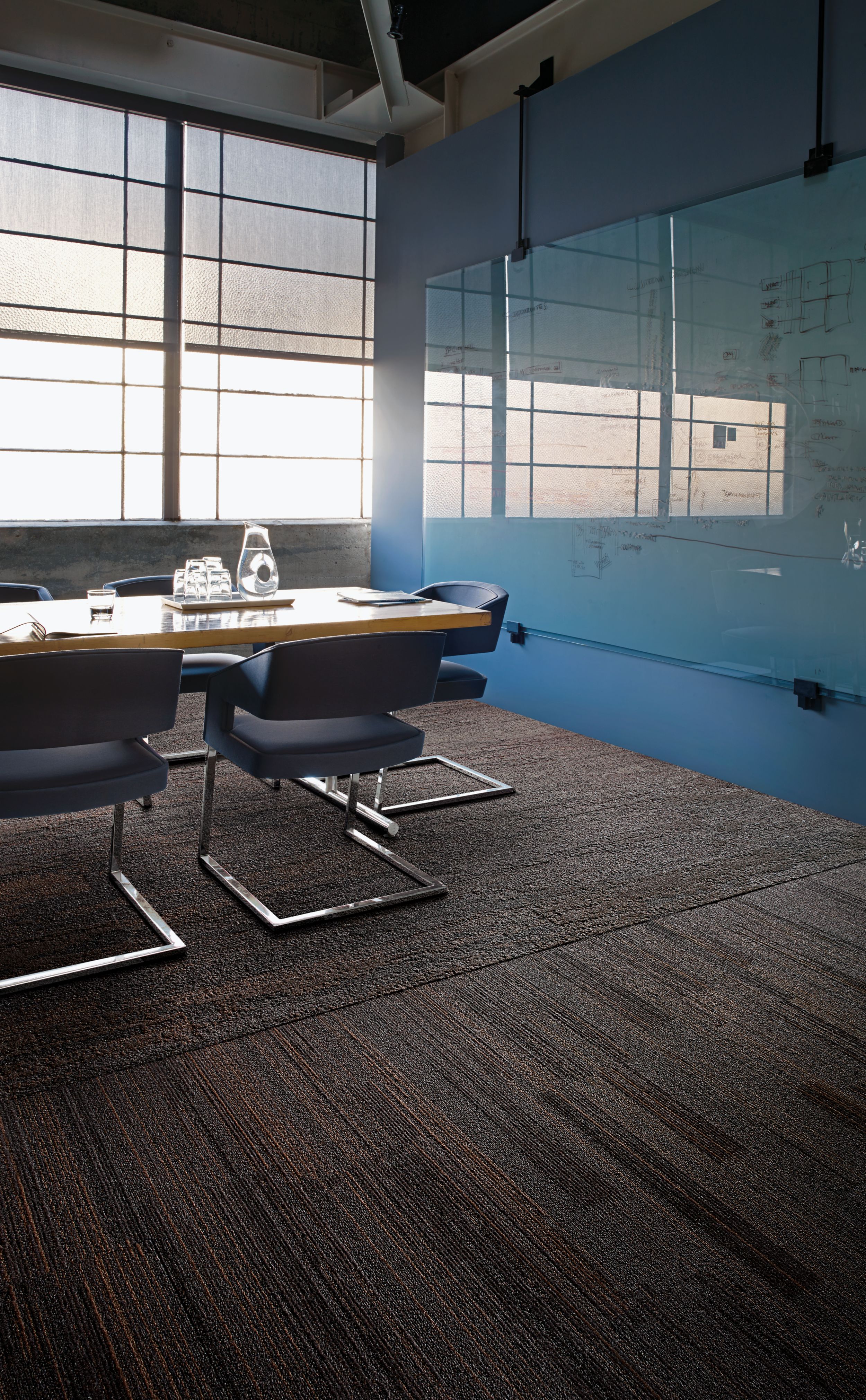Interface NF400 and NF401 plank carpet tile in office meeting room with light shining through window image number 6
