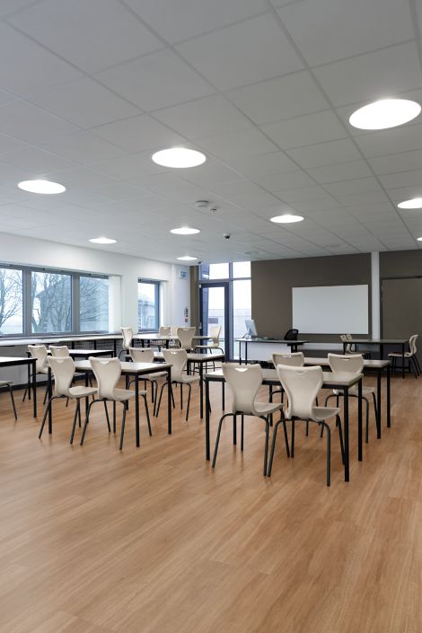 Interface Natural Woodgrains LVT meeting room with tables, chairs and white board image number 1