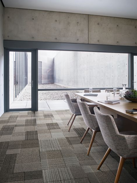 Interface ShadowBox Velour carpet tile in meeting room with glass wall and succulents on table