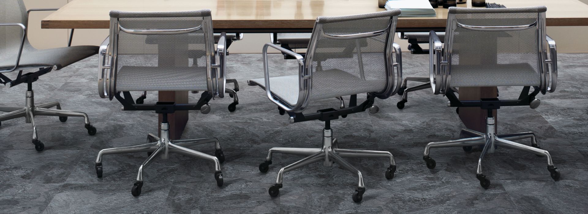 Interface Natural Stones LVT in a meeting room with conference table and chairs