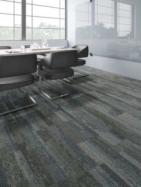 Interface Naturally Weathered plank carpet tile in office meeting room with reflection of natural light through windows