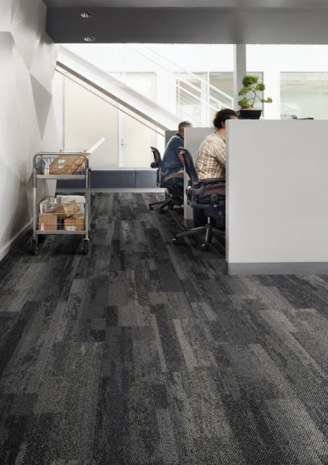 Interface Naurally Weathered plank carpet tile in office with cubicals and staircase in background