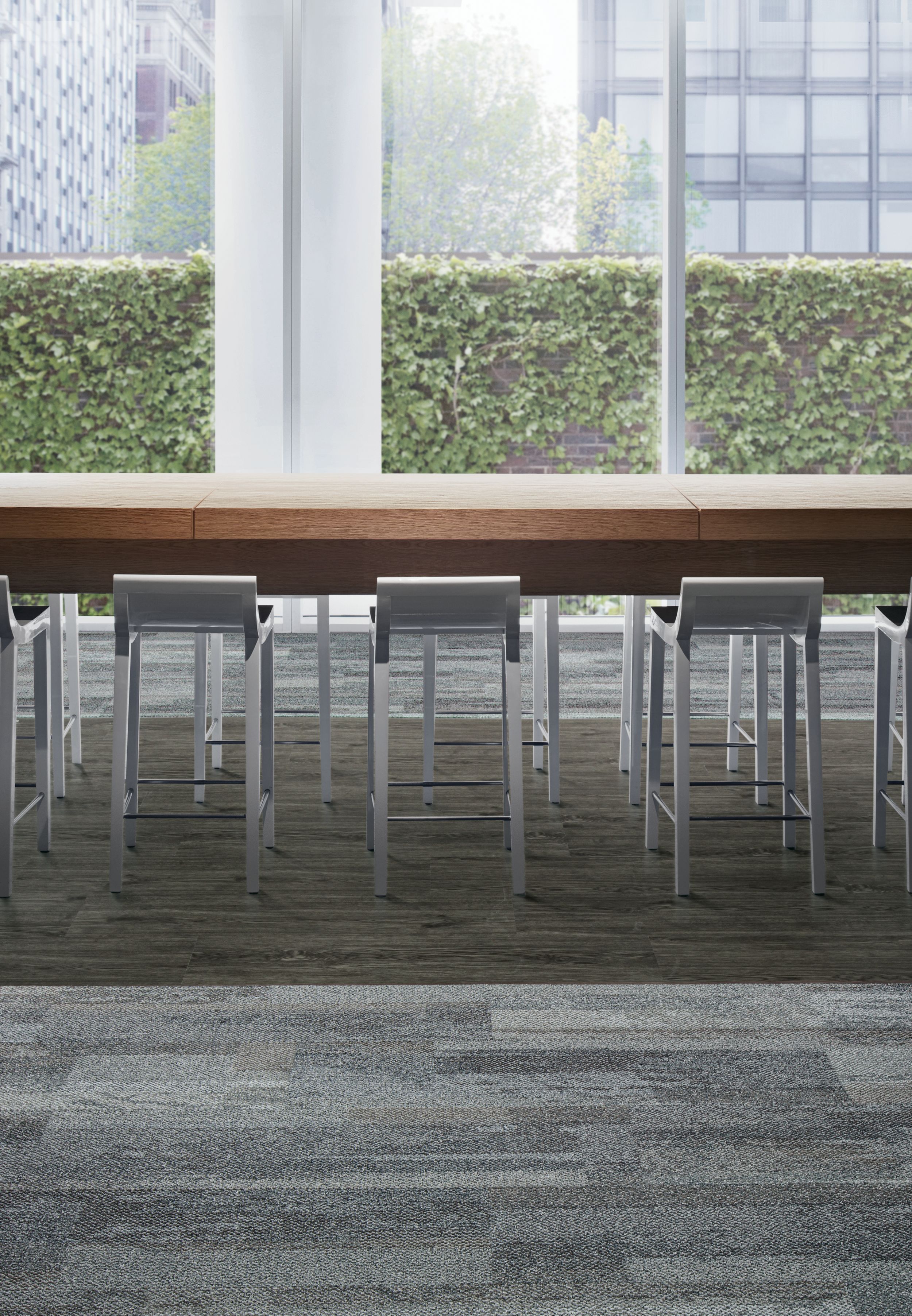 Interface Naturally Weathered plank carpet tile and Natural Woodgrains LVT with hightop meeting table and glass windows showing ivy covered wall image number 13
