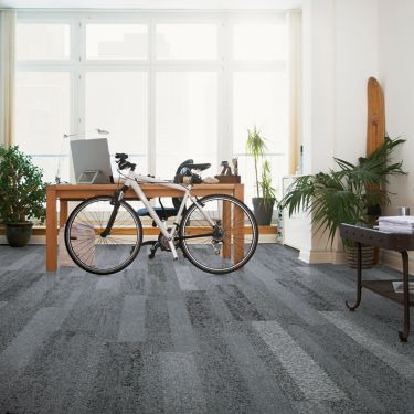 Interface Nature's Course plank carpet tile in private office with desk and bike imagen número 1