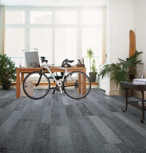 Interface Nature's Course plank carpet tile in private office with desk and bike image number 5