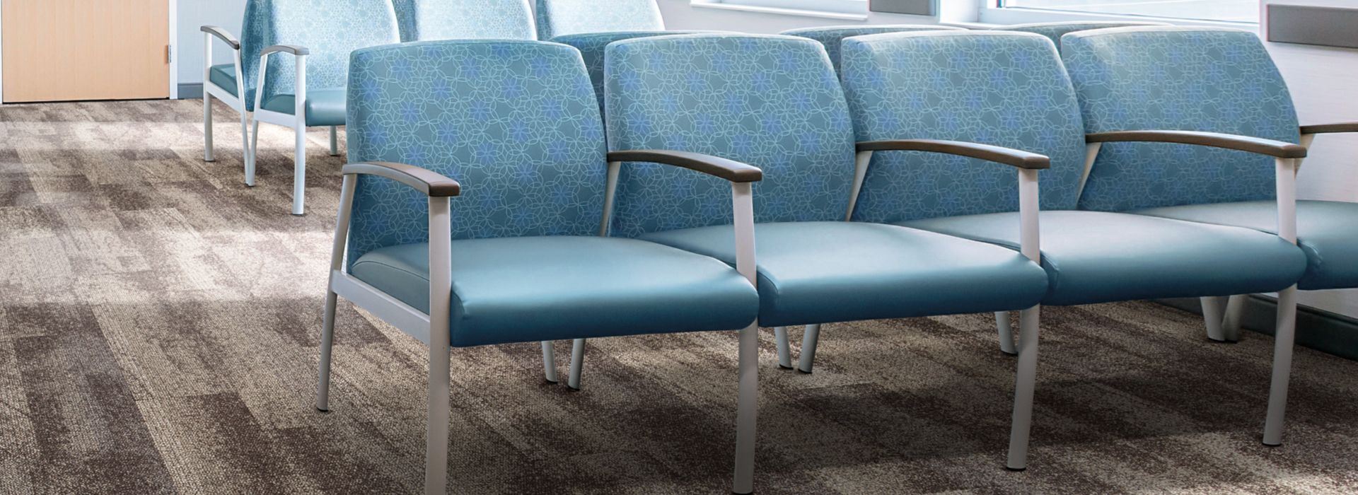 Interface Neighborhood Smooth plank carpet tile in waiting room with blue chairs