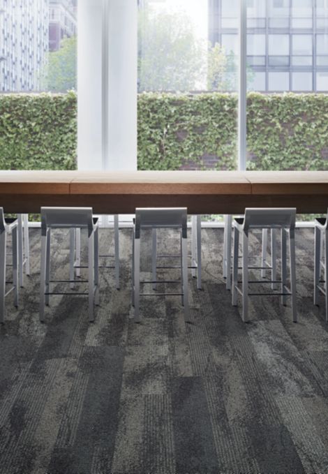 Interface Neighborhood Smooth plank carpet tile with hightop meeting table and glass windows showing ivy covered wall imagen número 3