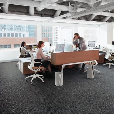 Interface Night Flight carpet tile in open office with people working at desks image number 1