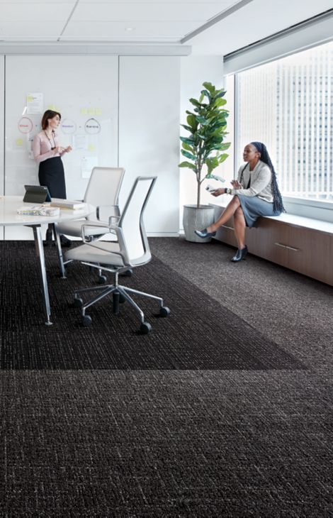 Interface Night Flight carpet tile and Haptic plank carpet tile in office working space with two women talking imagen número 6