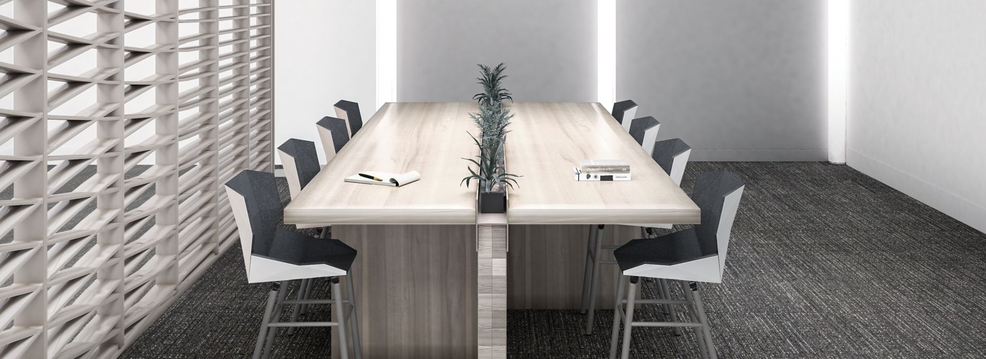 Interface Night Flight carpet tile in dining area with long wood table and long centered potted plant