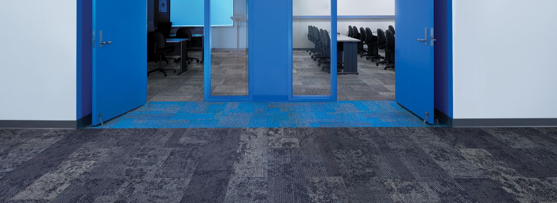 Interface Nimbus carpet tile plank, Cubic and Cubic Colours carpet tile in corridor entryway to classroom with blue doors