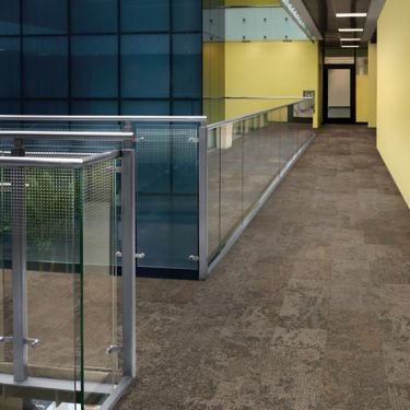 Interface Nimbus carpet tile plank in corridor with glass railing and yellow walls image number 1