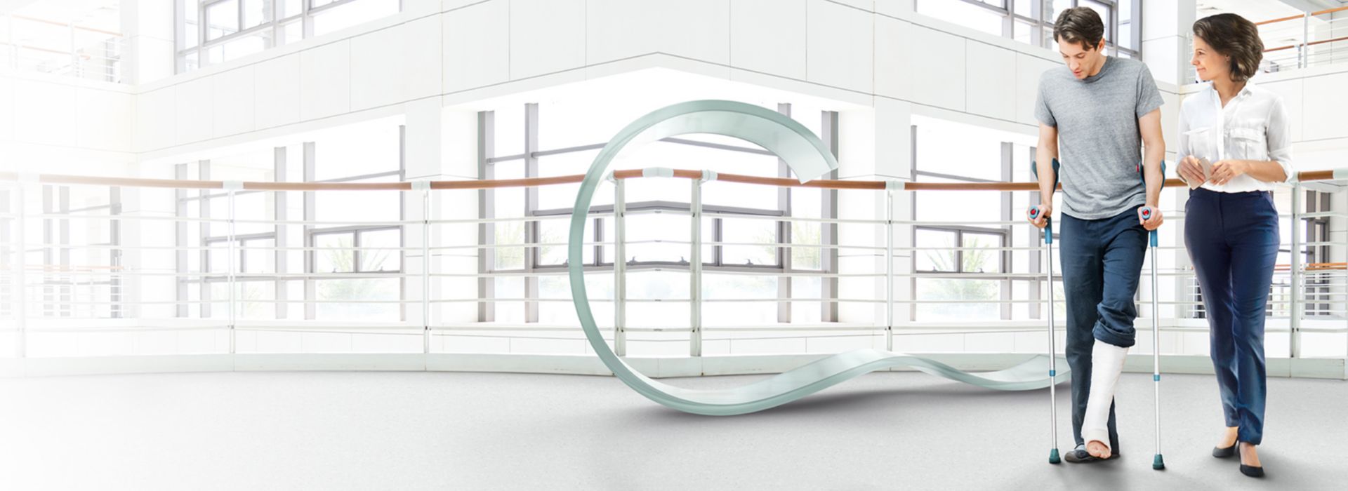 noraplan seneo rubber flooring in healthcare corridor with man and woman walking