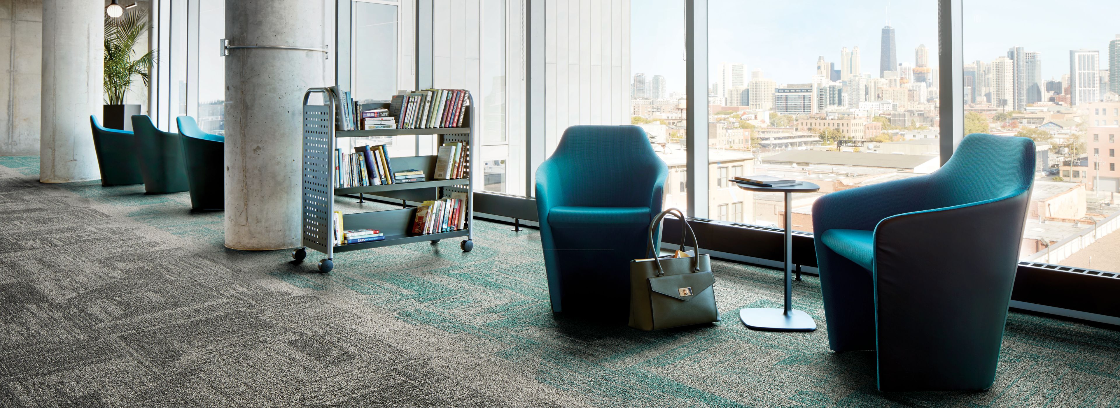 Interface Open Air 403 carpet tile in library with cement columns and city skyline in background through windows image number 1