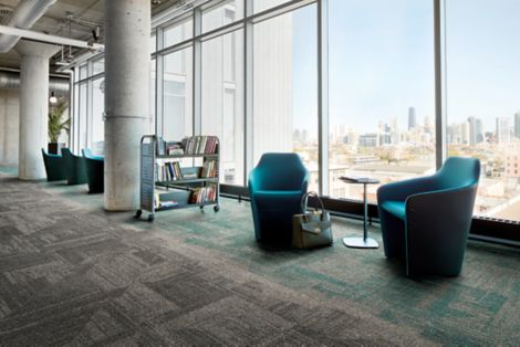 Interface Open Air 403 carpet tile in library with cement columns and city skyline in background through windows image number 11