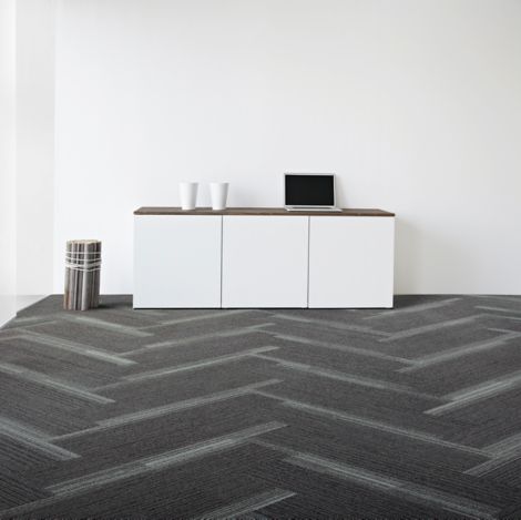Interface Off Line plank carpet tile in space with cabinet against wall and bundle of wood imagen número 6