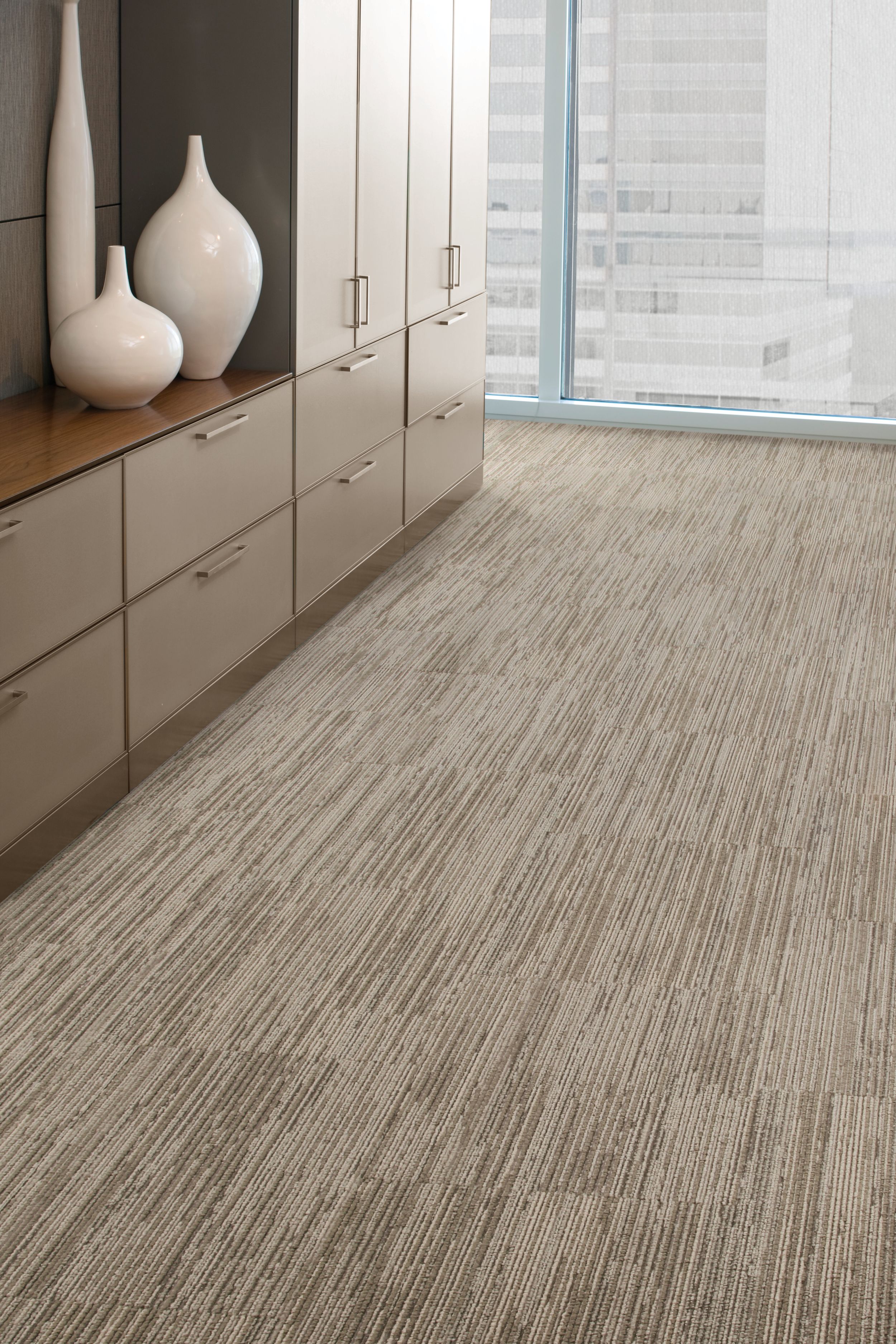 Interface On Board carpet tile in open area with cabinets and white vases image number 4