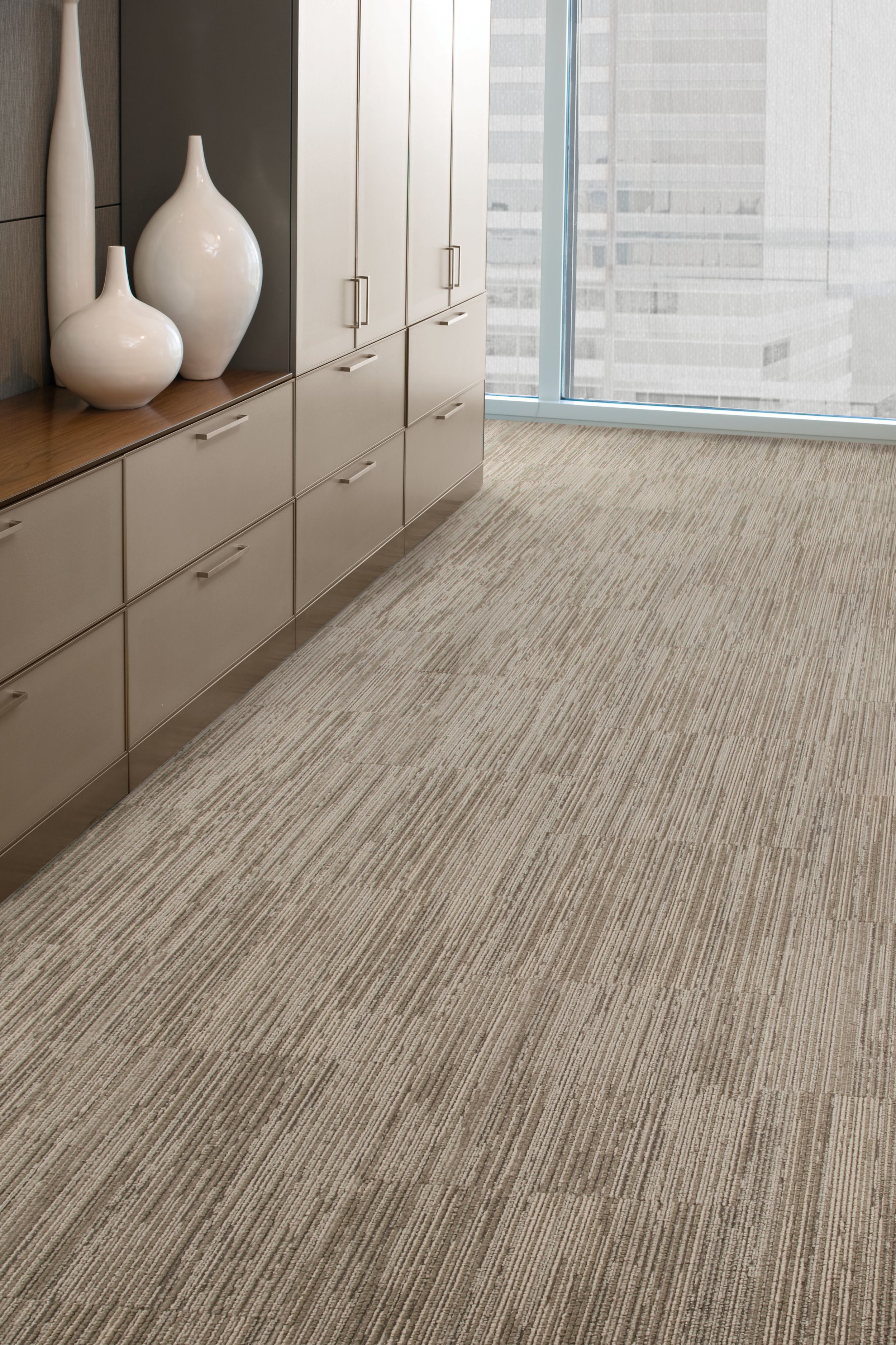 Interface On Board carpet tile in open area with cabinets and white vases imagen número 8