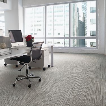 Interface On Line plank carpet tile with open workstation and roses on desk