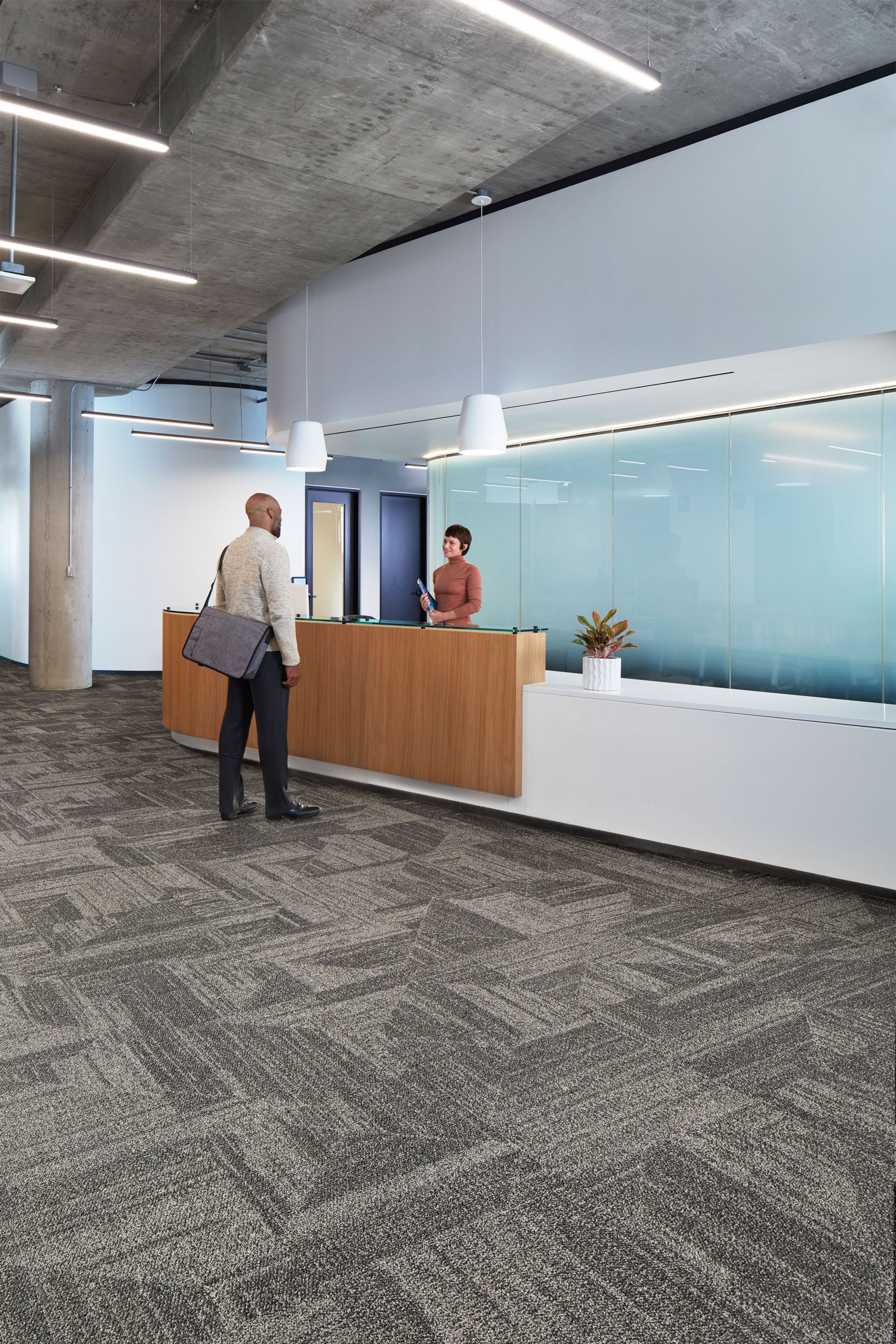 Interface Open Air 403 carpet tile in front desk area with man speaking with woman image number 2