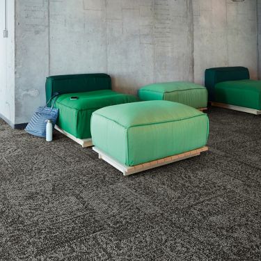 Interface Open Air 405 carpet tile with cement wall and green puffy chairs and ottomans image number 1