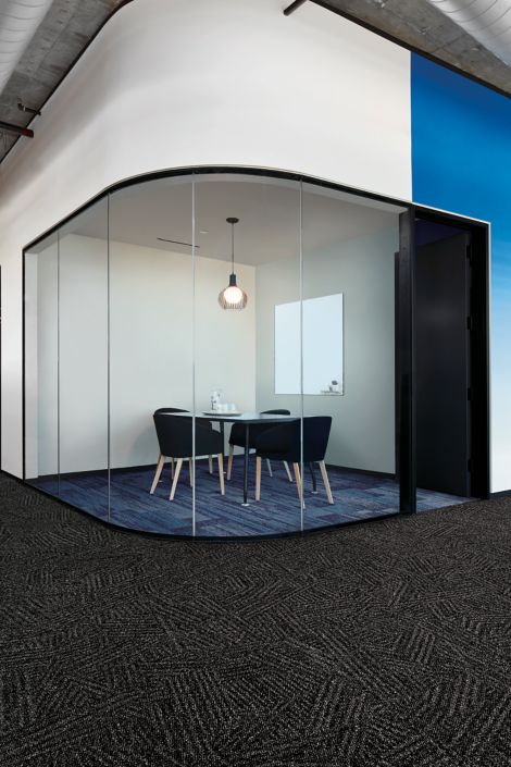 Interface AE317 plank carpet tile in enclosed meting room with Open Air 412 carpet tile in foreground