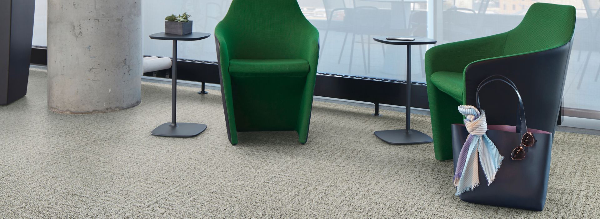 Interface Open Air 413 carpet tile in lounge space with green chairs and cement column