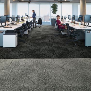 Interface Open Air 417 carpet tile in open workstation area with man working at standing desk