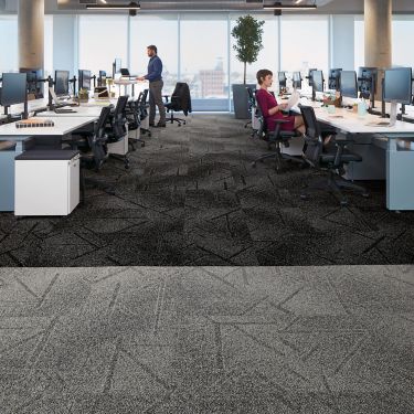 Interface Open Air 417 carpet tile in open workstation area with man working at standing desk image number 1