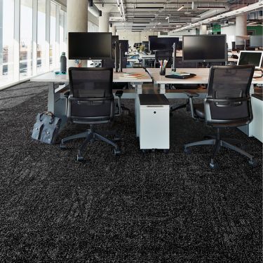 Interface Open Air 419 carpet tile in open work area with multiple workstations