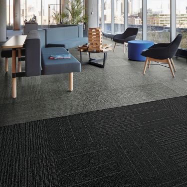 Interface Open Air 423 carpet tile in social space with blue seating and floor to ceiling windows image number 1