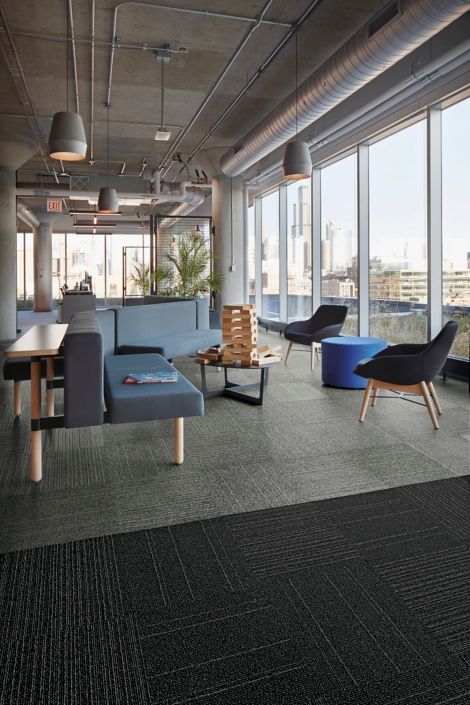 Interface Open Air 423 carpet tile in social space with blue seating and floor to ceiling windows image number 4
