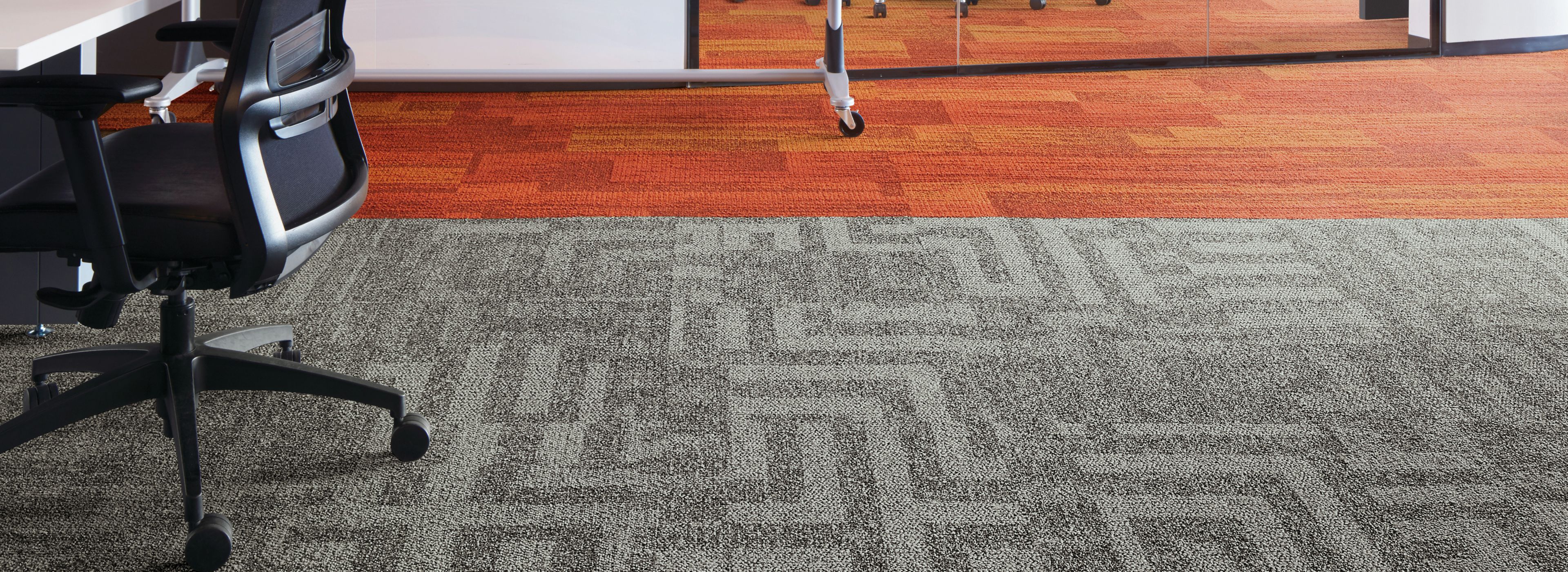 Interface Open Air 414 carpet tile with AE317 plank carpet tile in corner workstation with whiteboard and meeting room in background image number 1