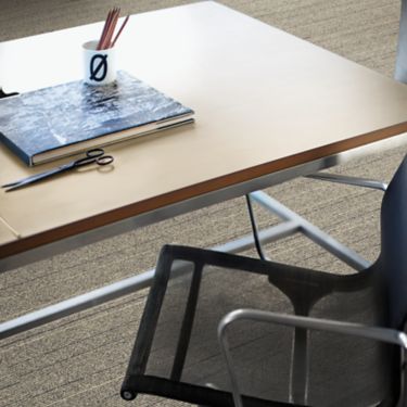 Interface PH211 plank carpet tile in close up with desk and chair image number 1