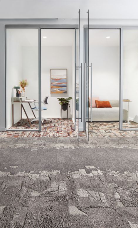 Interface Mountain Rock, Bridge Creek, Flat Rock, and Panola Mountain carpet tile in entryway to two small divided rooms with a couch and a desk image number 5