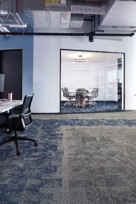 Interface Open Air 404 carpet tile with meeting room in background with glass wall